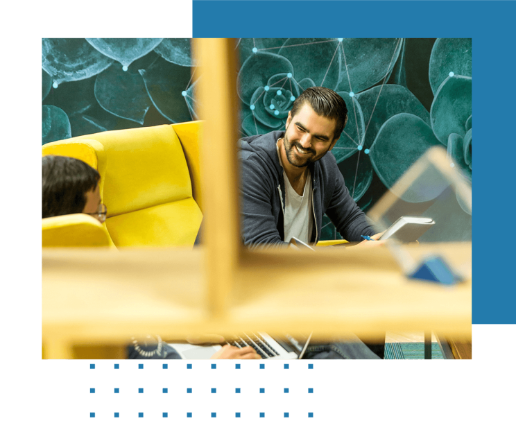Colleagues exchange views on server infrastructure in meeting room