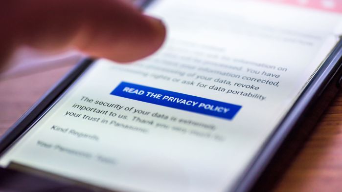 A picture of a smartphone can be seen in the foreground.