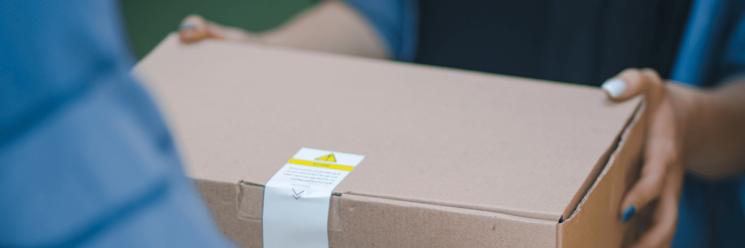 A package in the hands of two people.