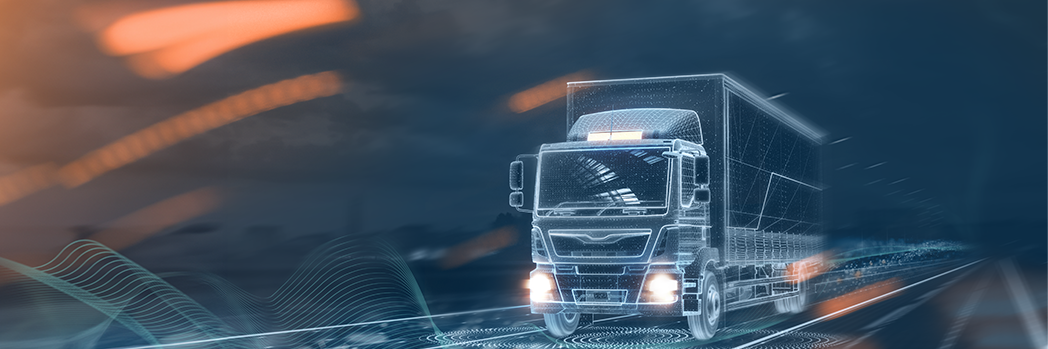 A shadowy truck drives along an implied road. The picture is in blue and orange tones.